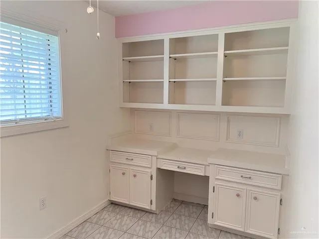 a view of cabinets and window