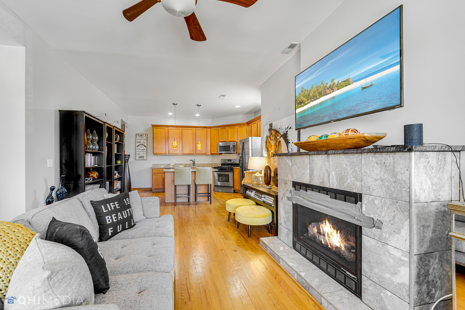 4341 South Prairie Avenue, Unit 2 Chicago, IL 60653 - Photo 4 of 11 a living room with furniture and a fireplace