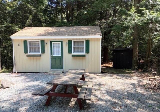 759 North Main Road, Unit V8J Otis, MA 01253 - Photo 4 of 21 a view of a house with backyard and sitting area