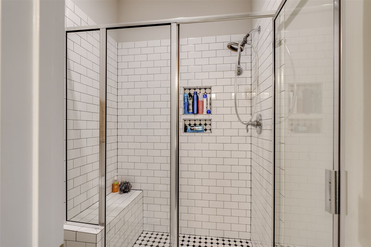 7504 Pinaster Place Raleigh, NC 27613 - Photo 20 of 30 2nd floor - Jack and Jill bathroom. Subway tile w/ bench & niche perfect for all your hair products/shower essentials! Bathroom