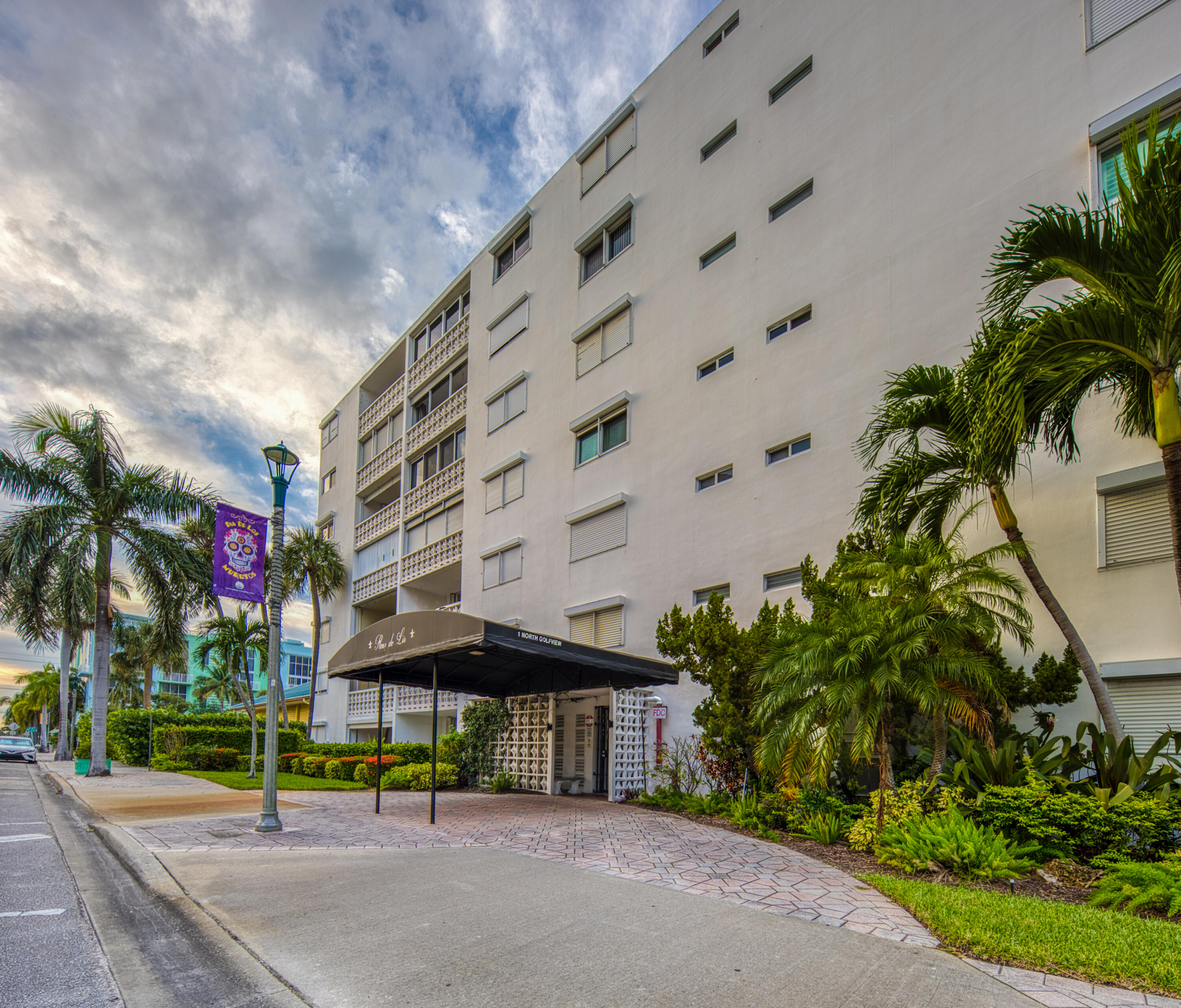1 North Golfview Road, Unit 601 Lake Worth Beach, FL 33460 - Photo 20 of 51 a street sign on a sidewalk next to a building