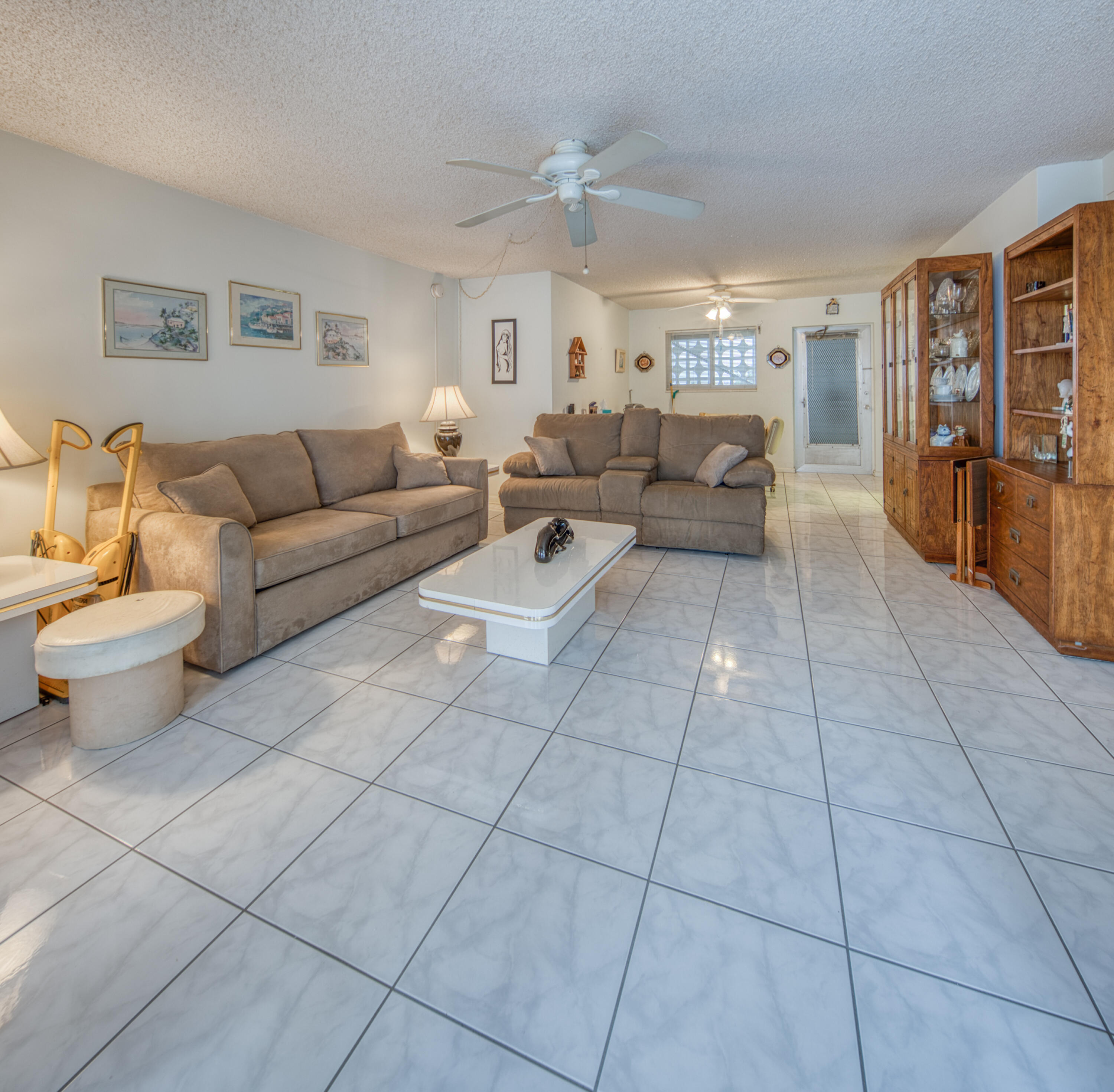 1 North Golfview Road, Unit 601 Lake Worth Beach, FL 33460 - Photo 23 of 51 a living room with furniture a dining table and a view of kitchen