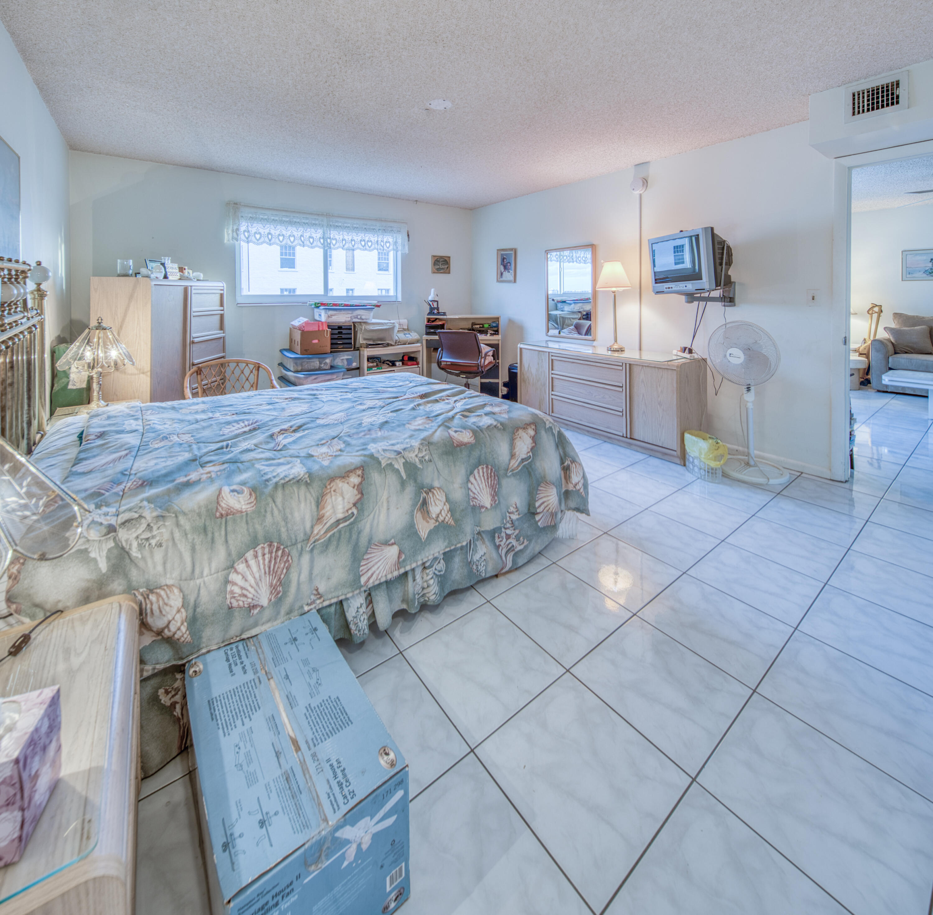 1 North Golfview Road, Unit 601 Lake Worth Beach, FL 33460 - Photo 25 of 51 a bedroom with a large bed and a large window