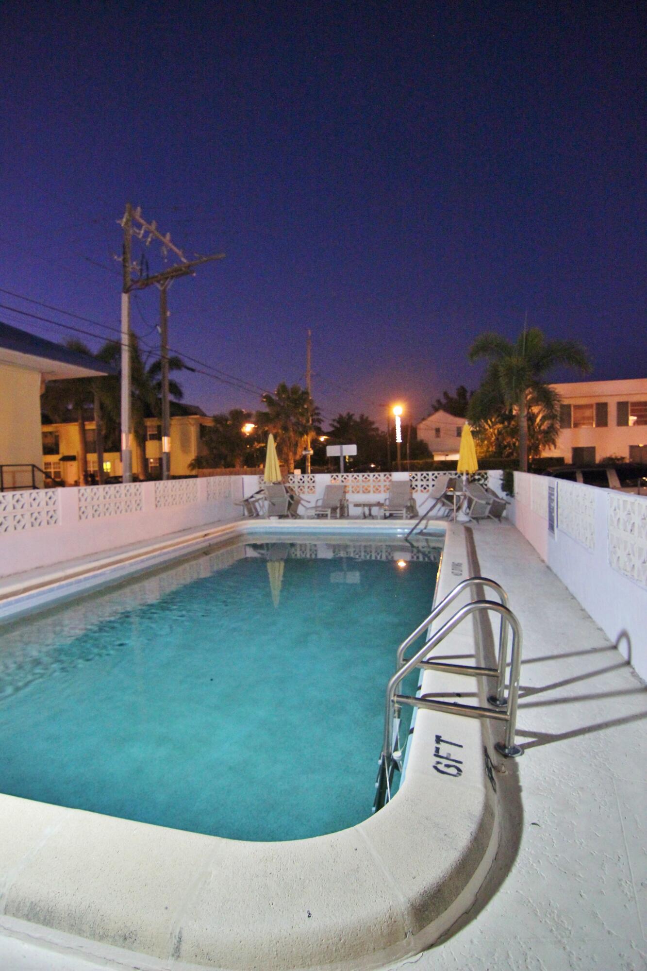 1 North Golfview Road, Unit 601 Lake Worth Beach, FL 33460 - Photo 34 of 51 a view of a swimming pool with a yard