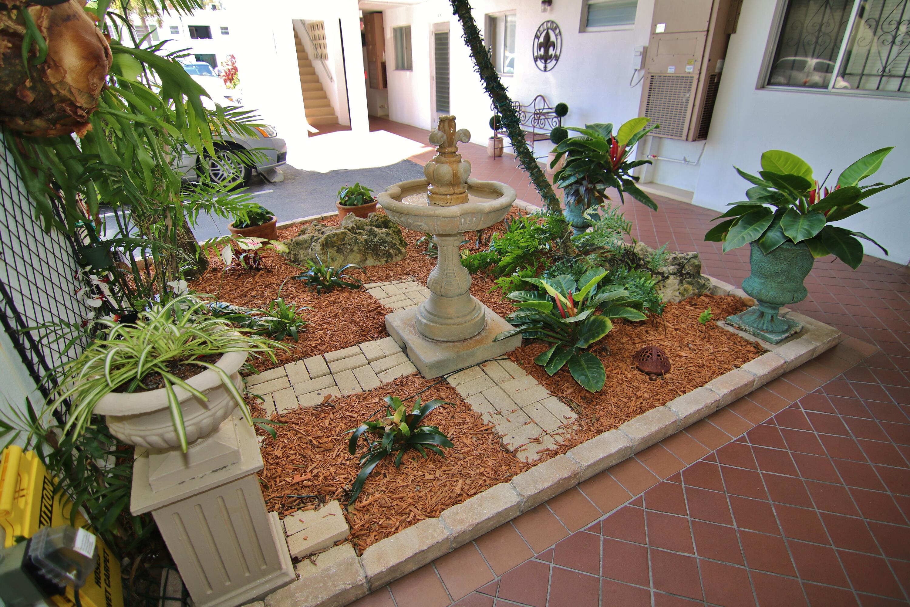1 North Golfview Road, Unit 601 Lake Worth Beach, FL 33460 - Photo 39 of 51 a vase of flowers sitting on a table
