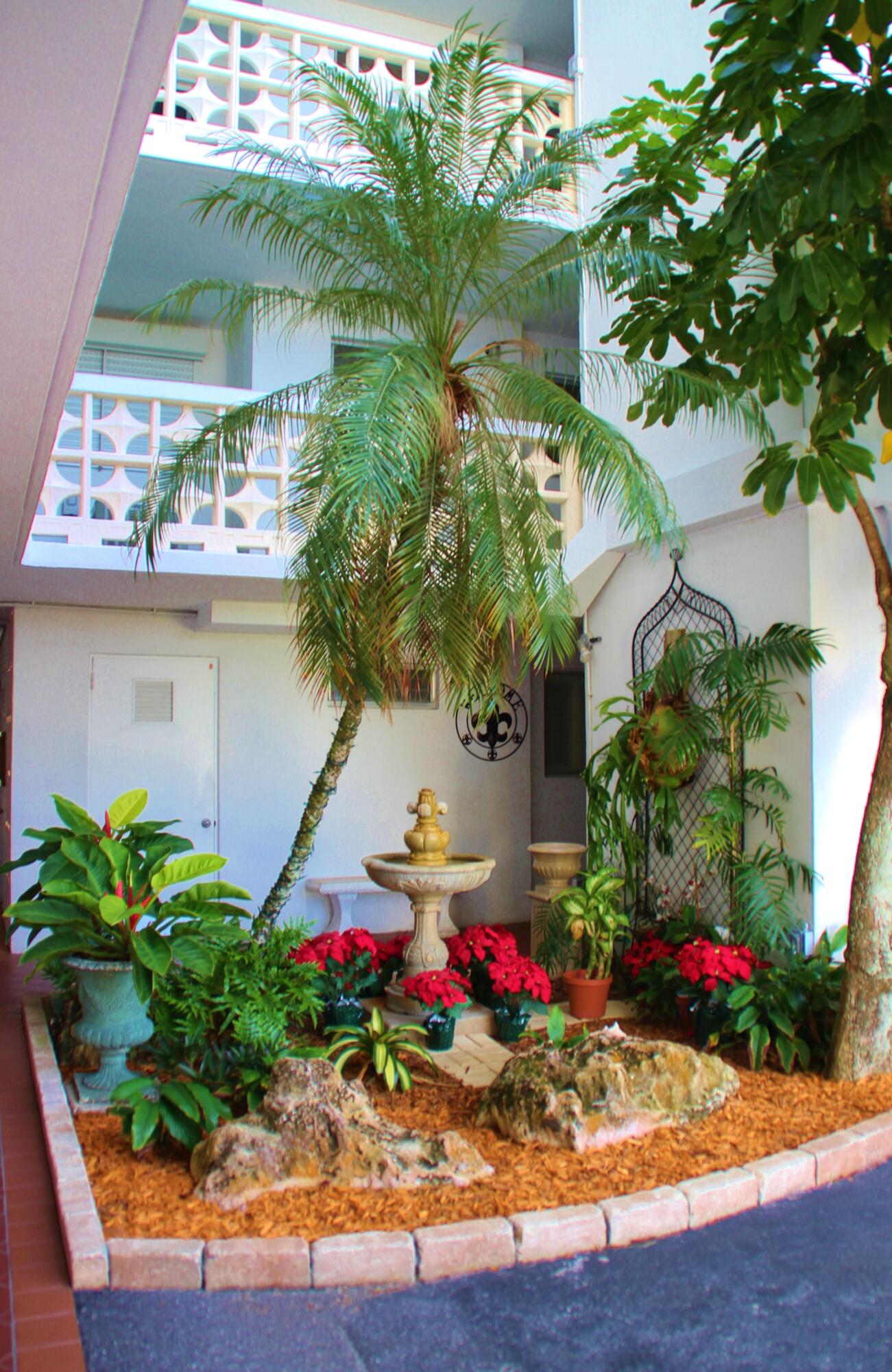 1 North Golfview Road, Unit 601 Lake Worth Beach, FL 33460 - Photo 45 of 51 a view of a flower in a yard