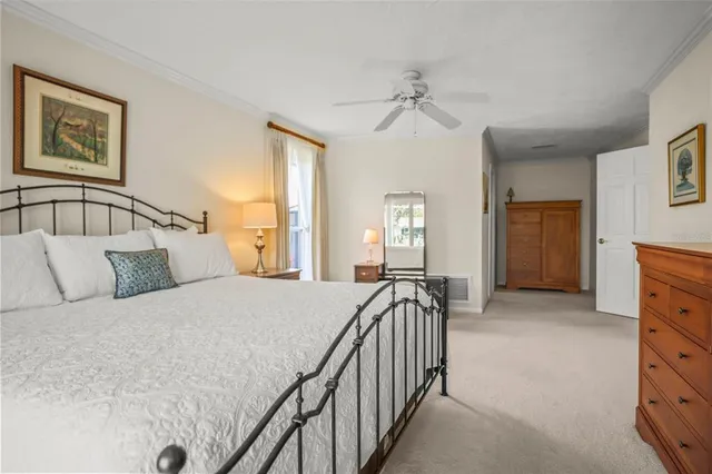 a white toilet sitting next to a shower