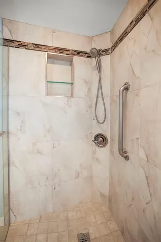 a living room with furniture and a chair