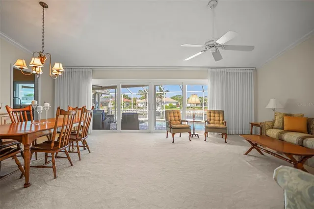 a view of a house with yard and lake view