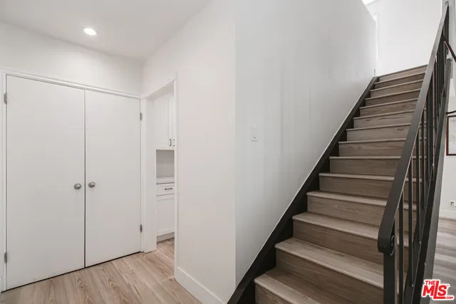 a view of an entryway with wooden floor