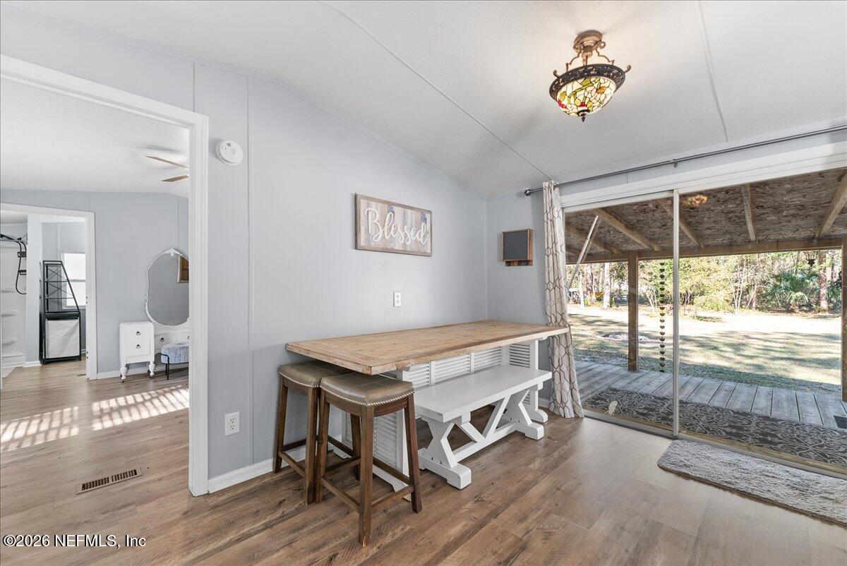 4070 Pinto Road Middleburg, FL 32068 - Photo 21 of 37 a living room with a table and a large window