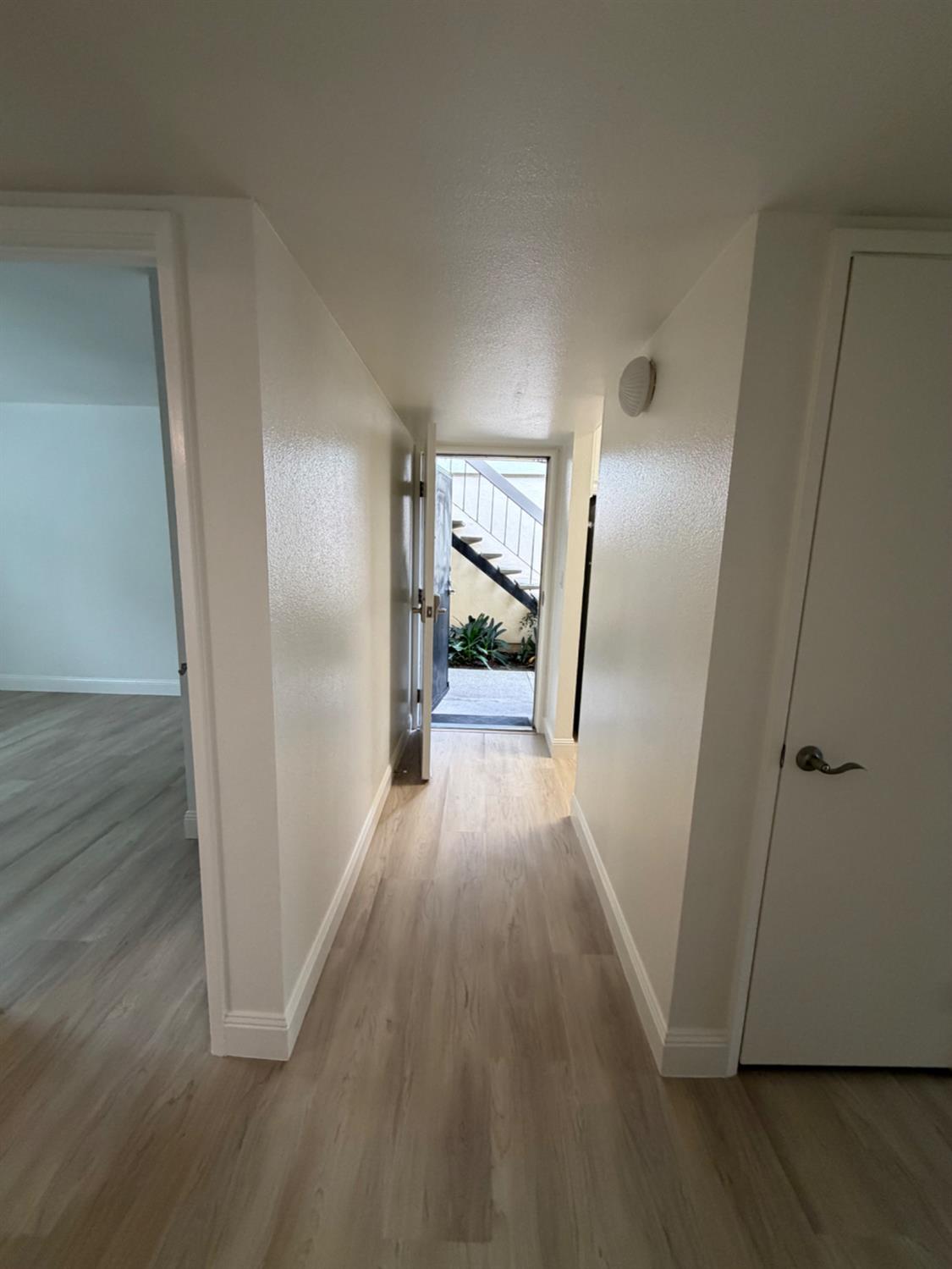 6241 Riverside Boulevard, Unit 112 Sacramento, CA 95831 - Photo 21 of 33 a view of a hallway with wooden floor