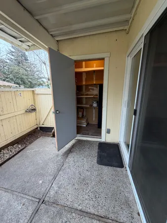 a view of closet area with empty racks