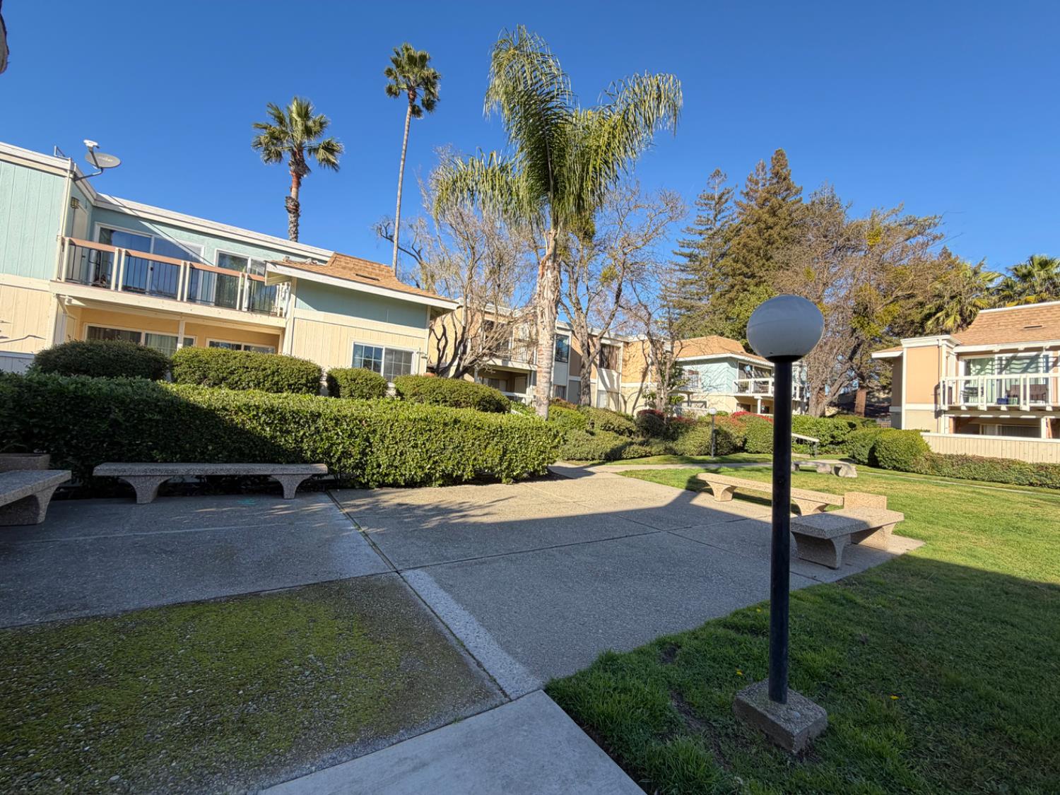 6241 Riverside Boulevard, Unit 112 Sacramento, CA 95831 - Photo 28 of 33 a front view of a house with garden