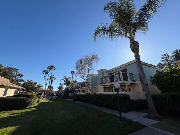 a view of a backyard with sitting area