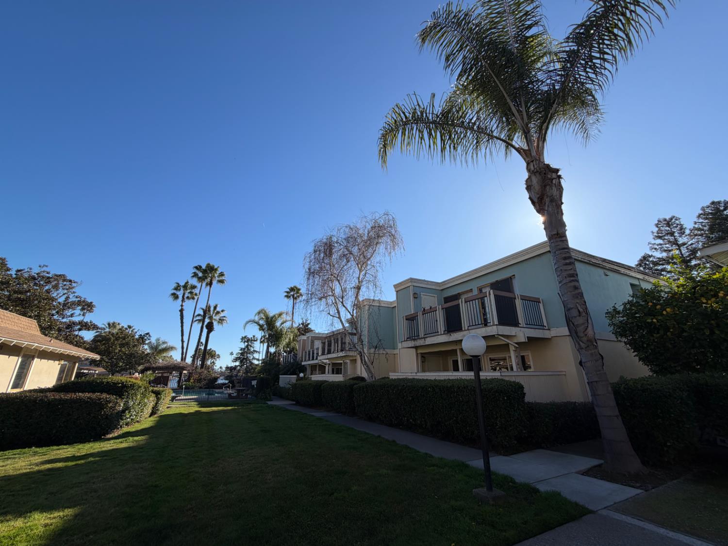 6241 Riverside Boulevard, Unit 112 Sacramento, CA 95831 - Photo 29 of 33 a front view of a house with a garden