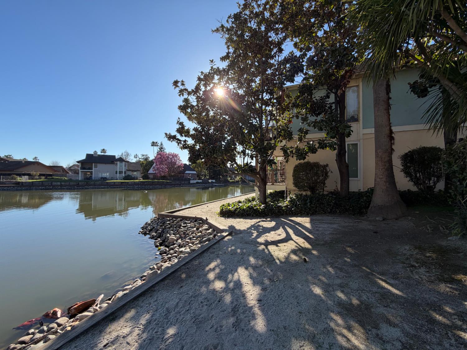 6241 Riverside Boulevard, Unit 112 Sacramento, CA 95831 - Photo 32 of 33 a view of a lake with sitting area