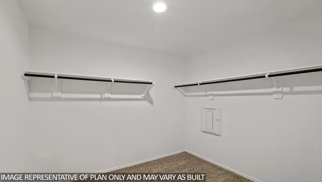 a view of an empty walk in closet