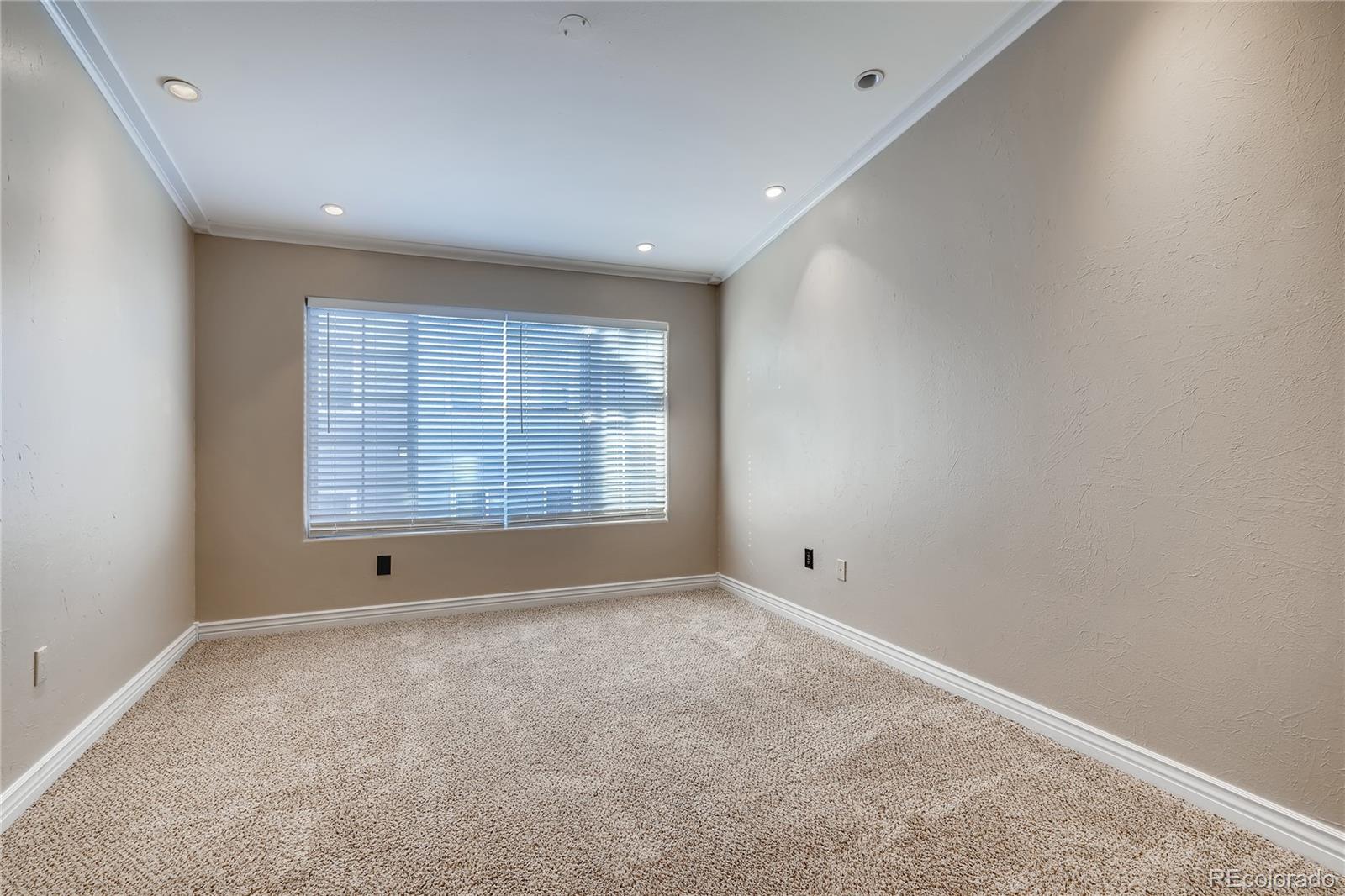 8459 South Little Rock Way, Unit 201 Highlands Ranch, CO 80126 - Photo 12 of 28 a view of an empty room with a window