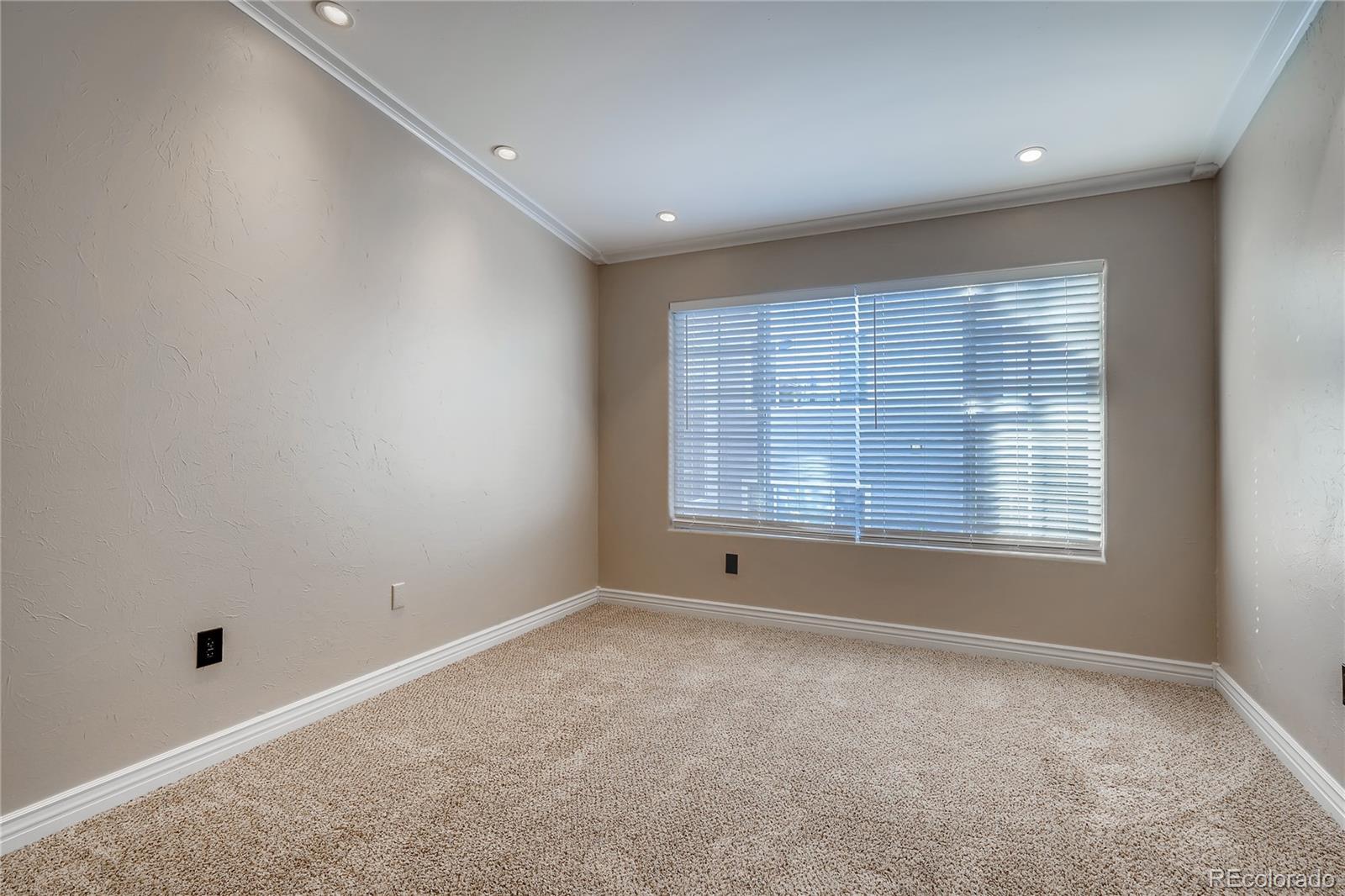 8459 South Little Rock Way, Unit 201 Highlands Ranch, CO 80126 - Photo 13 of 28 a big room with windows