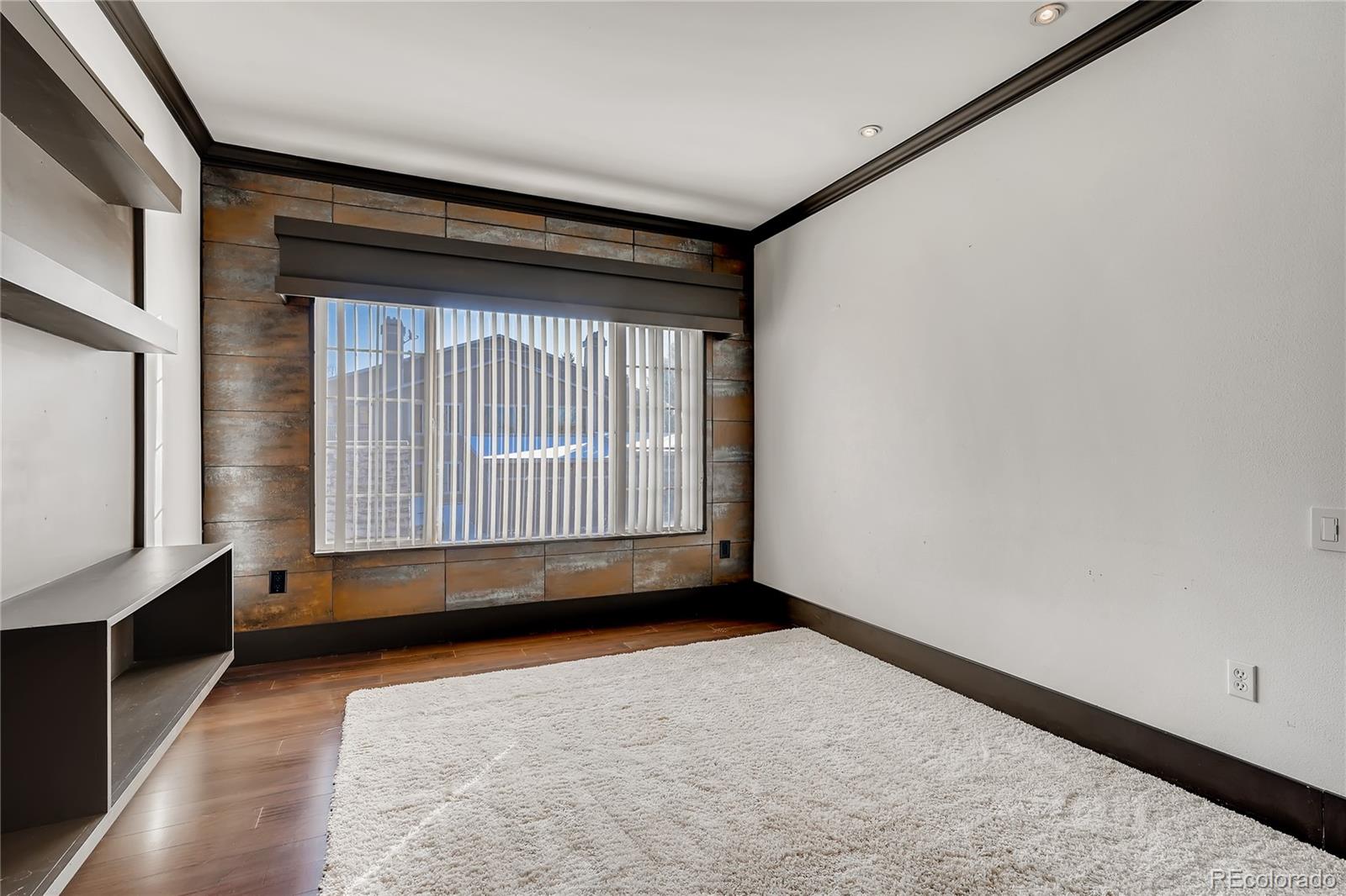8459 South Little Rock Way, Unit 201 Highlands Ranch, CO 80126 - Photo 18 of 28 a view of an empty room with a window