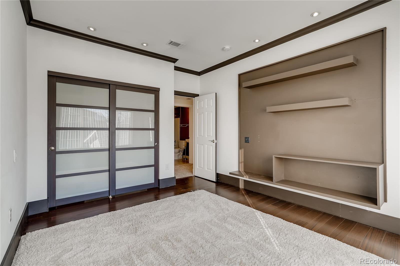 8459 South Little Rock Way, Unit 201 Highlands Ranch, CO 80126 - Photo 21 of 28 a view of an empty room with a fireplace and a window