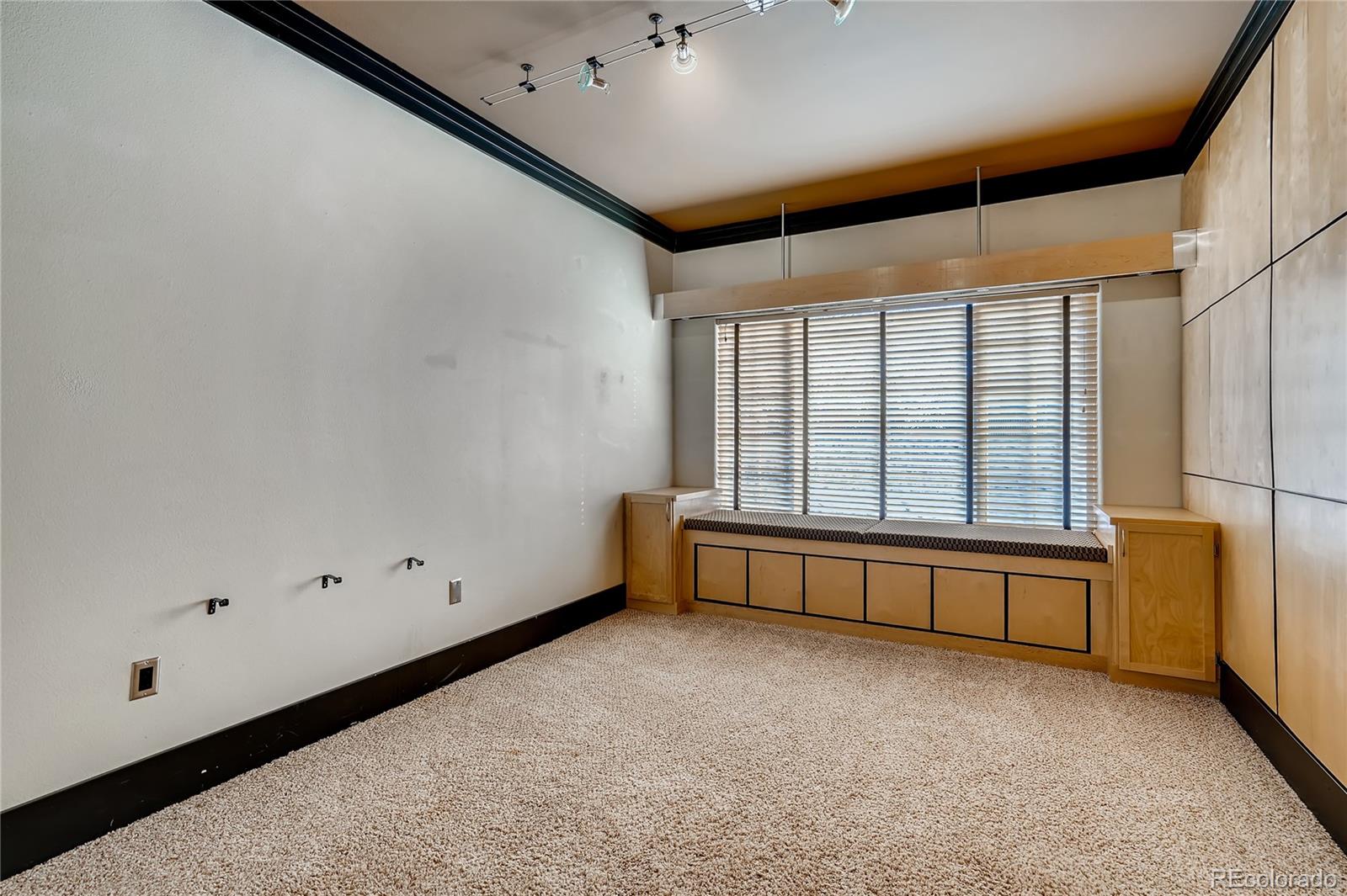 8459 South Little Rock Way, Unit 201 Highlands Ranch, CO 80126 - Photo 22 of 28 a view of an empty room with a window