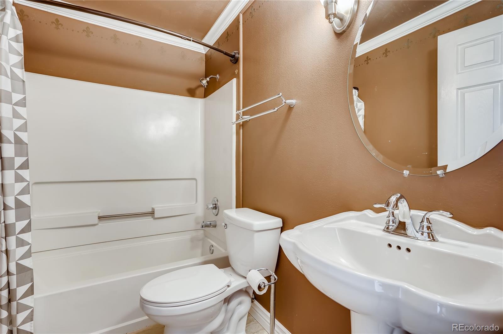 8459 South Little Rock Way, Unit 201 Highlands Ranch, CO 80126 - Photo 26 of 28 a bathroom with a sink toilet and shower