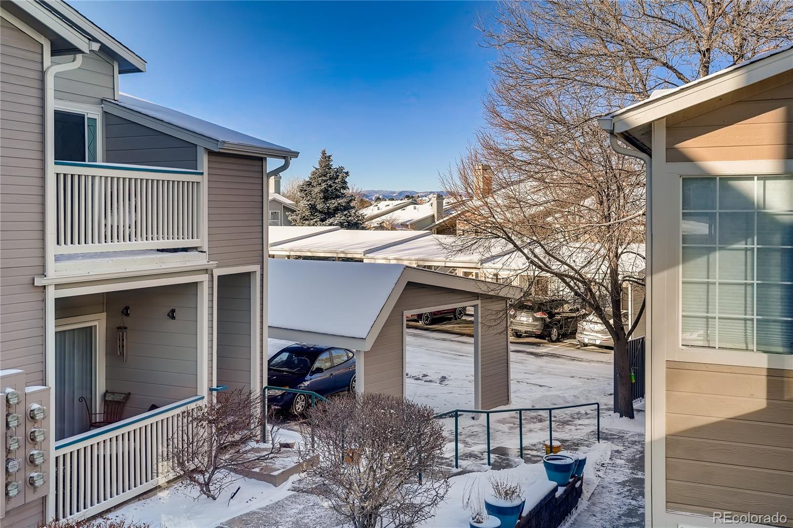 8459 South Little Rock Way, Unit 201 Highlands Ranch, CO 80126 - Photo 28 of 28 a backyard of a house with table and chairs