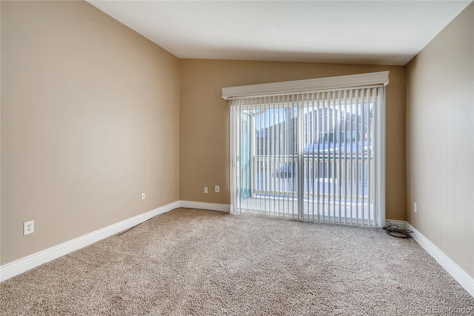 8459 South Little Rock Way, Unit 201 Highlands Ranch, CO 80126 - Photo 5 of 28 an empty room with windows