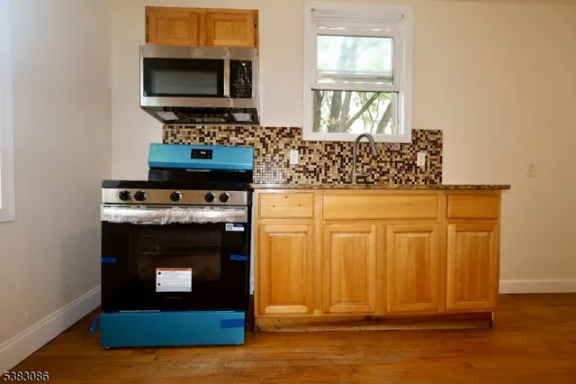 a living room with a fireplace and a flat screen tv