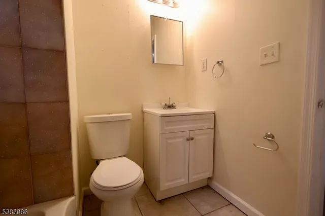 a bathroom with a toilet and a sink