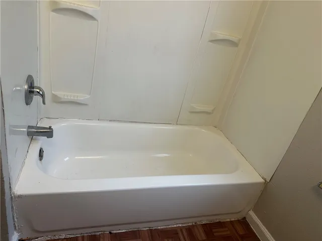 a white toilet sitting next to a white sink