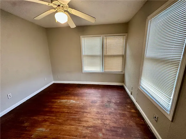 a view of a park with large trees