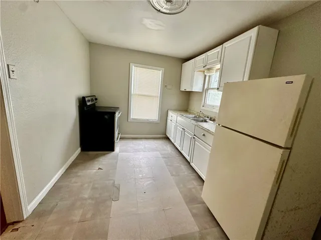 a view of kitchen with furniture and wooden floor