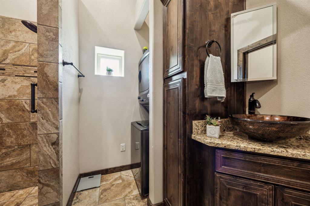 10761 County Road 2326 Terrell, TX 75160 - Photo 29 of 35 Casita Full bath with vanity, a tile shower, baseboards, and stone finish floor