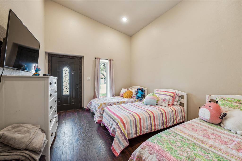 10761 County Road 2326 Terrell, TX 75160 - Photo 30 of 35 Casita Bedroom featuring hardwood / wood-style flooring, high vaulted ceiling, and recessed lighting