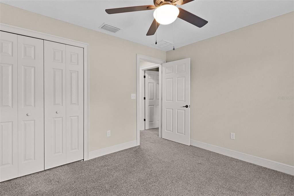 13 Malauka Radial Run Road Ocklawaha, FL 32179 - Photo 17 of 32 an empty room with fan