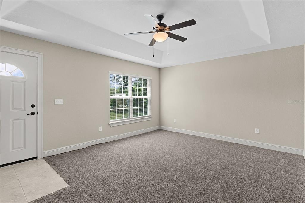 13 Malauka Radial Run Road Ocklawaha, FL 32179 - Photo 3 of 32 a view of an empty room with a window