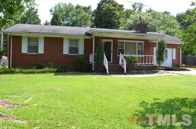 4621 Redwood Road Durham, NC 27704 - Photo 2 of 13 a front view of house with yard and green space