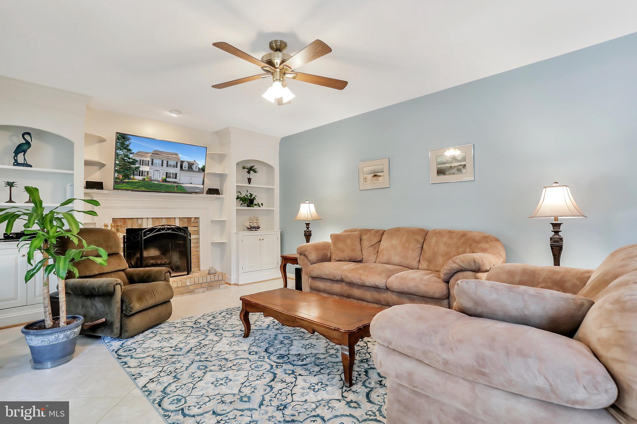 6330 Spring Forest Road Frederick, MD 21701 - Photo 15 of 74 Family room with lovely built-ins & gas fireplace