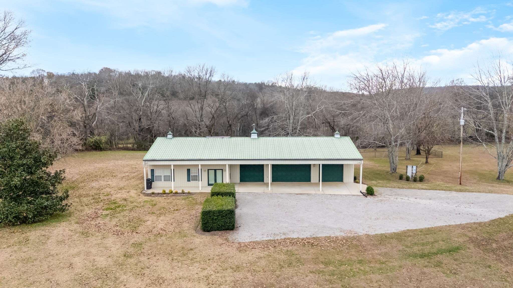 3100 Floyd Road Eagleville, TN 37060 - Photo 32 of 62 a view of a white house with a yard and road