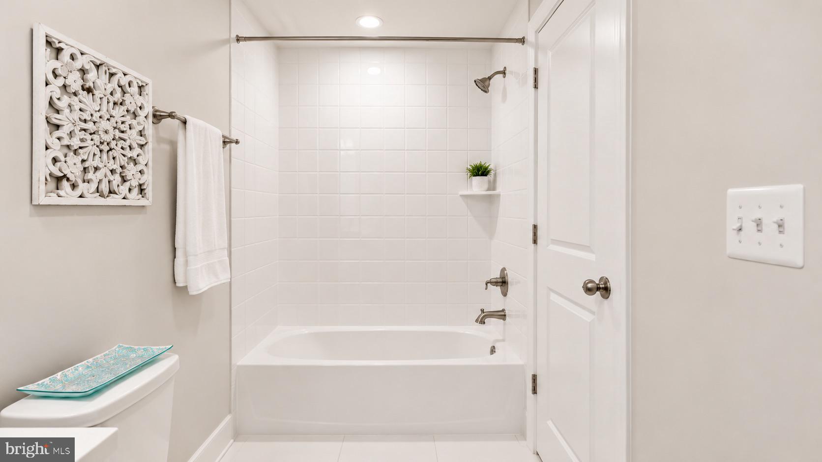 23609 Roselle Ridge Lane Aldie, VA 20105 - Photo 61 of 75 Modern serenity in a sleek bathroom.
