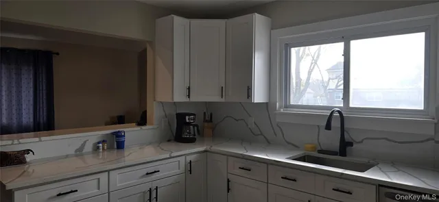 a kitchen with a sink and cabinets