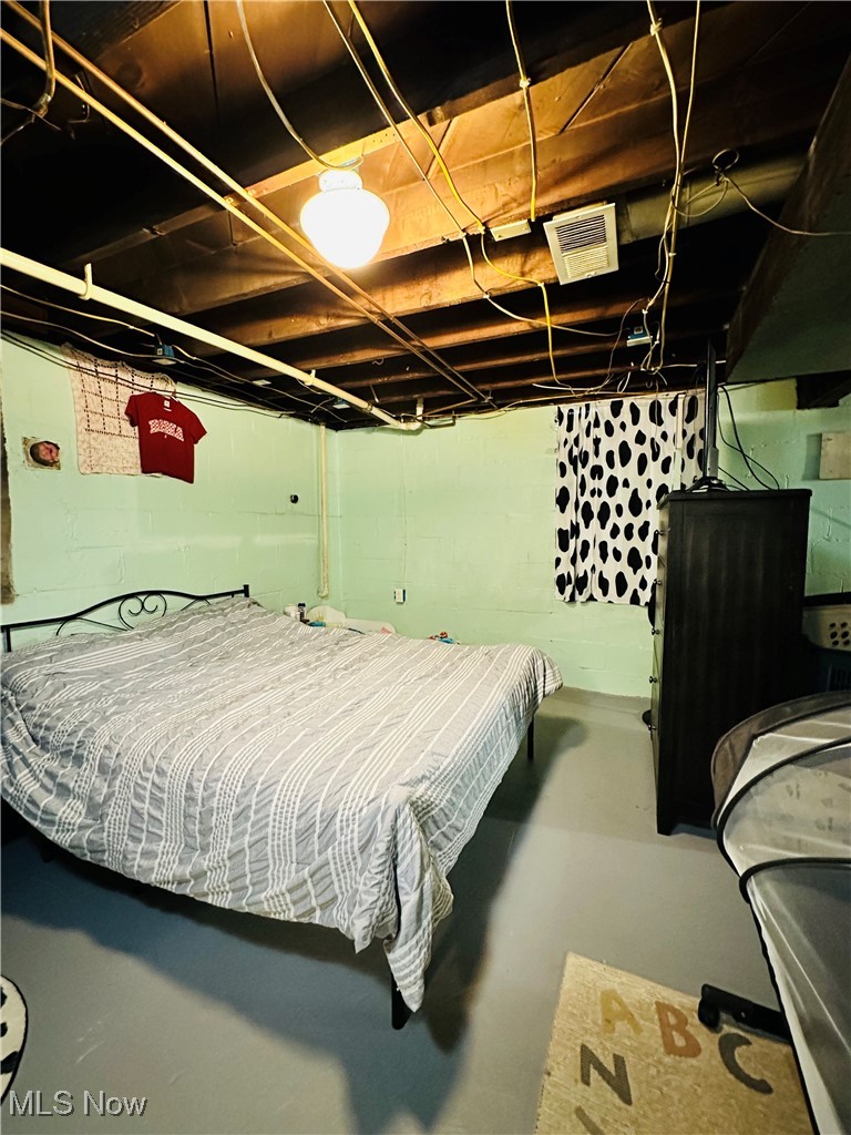 418 Main Street Philo, OH 43771 - Photo 27 of 37 Bedroom featuring finished concrete floors