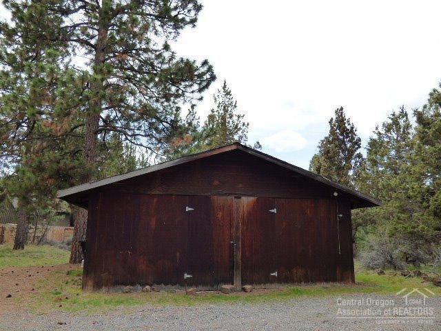 3202 McClellan Road Bend, OR 97702 - Photo 16 of 25 a barn with a small yard
