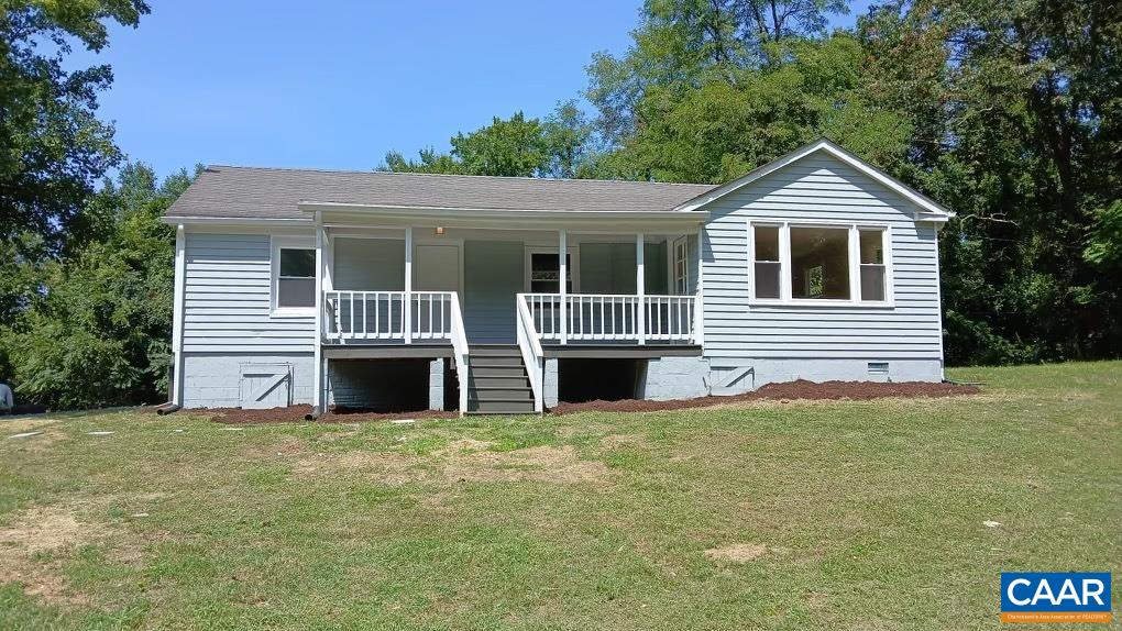 7548 Laurel Road Shipman, VA 22971 - Photo 2 of 10 a front view of a house with yard and glass windows