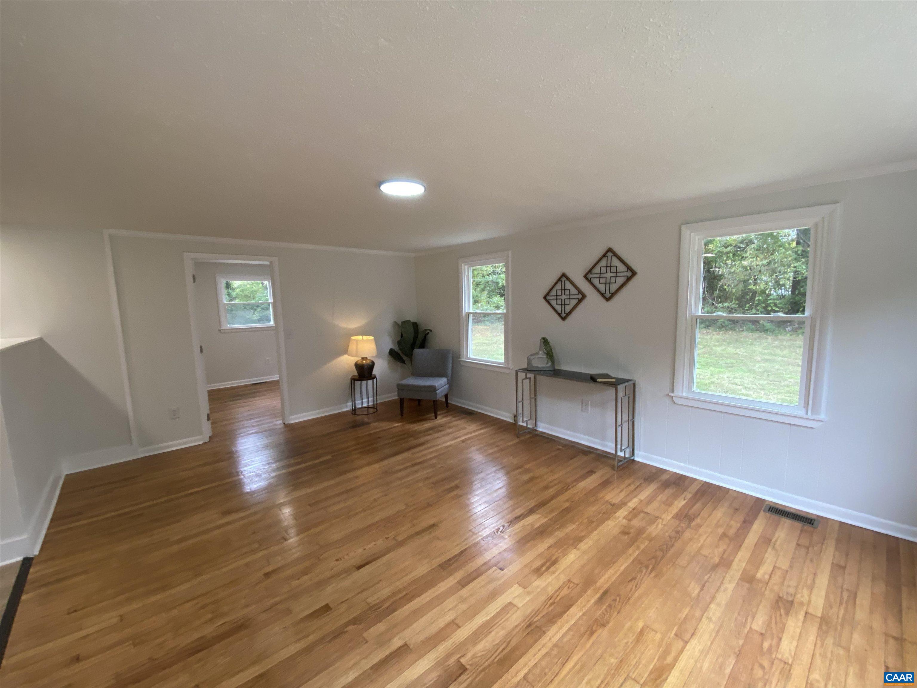 7548 Laurel Road Shipman, VA 22971 - Photo 5 of 10 a living room with furniture and a wooden floor