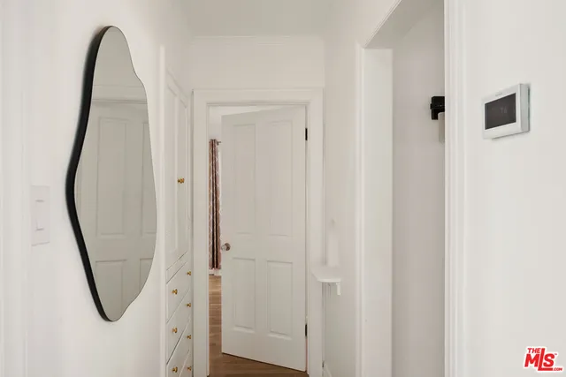 a view of a bathroom with mirror