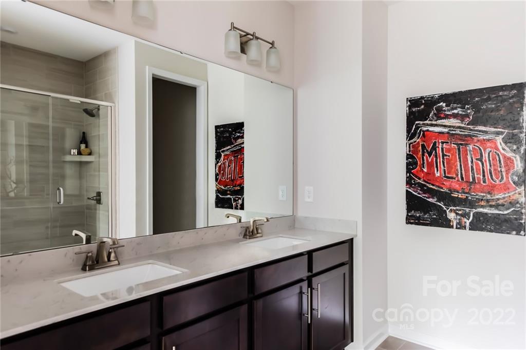 535 Madison Falls Court Fort Mill, SC 29708 - Photo 14 of 28 a bathroom with a sink and a mirror